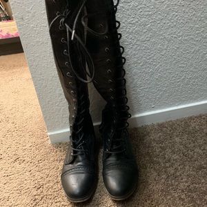 Lace up thigh high boots.